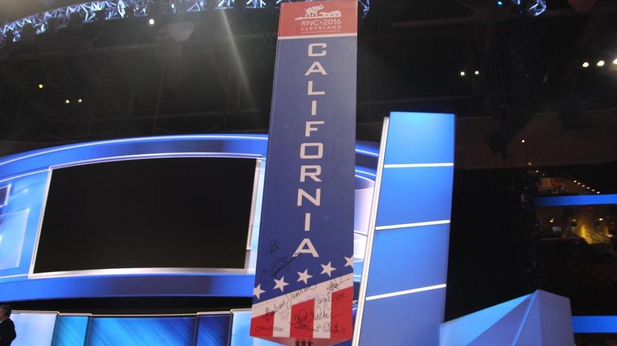 Signatures decorate the California delegation sign at the Republican National Convention.