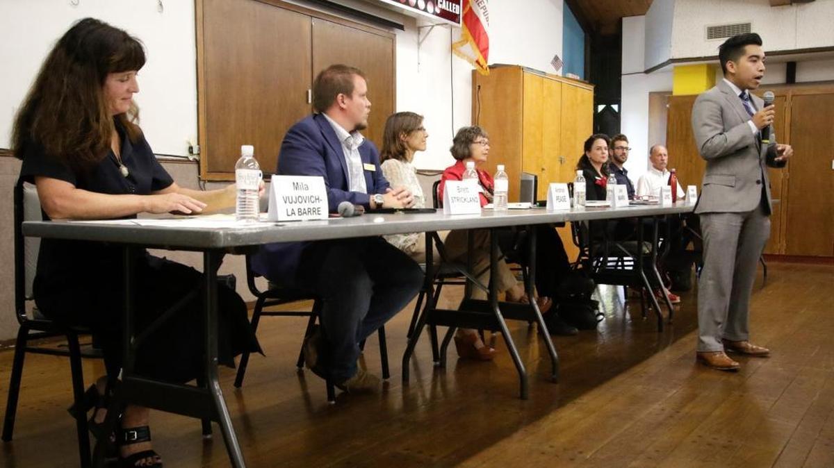Candidates for San Luis Obispo City Council and mayor attend a forum at the Senior Citizens Center in San Luis Obispo. From left: Mila Vujovich-La Barre, Brett Strickland, Andy Pease, Jan Marx, Heidi Harmon, Aaron Gomez, Michael Clark, Christopher Lopez (standing). Marx and Harmon are running for mayor, the others for council.