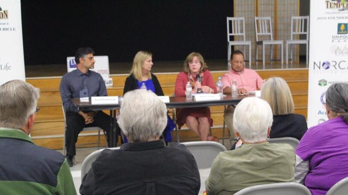 Templeton voters listen Wednesday to community services district candidate Debra Logan (third from left) speak at a Chamber of Commerce forum. From left, candidates Navid Fardanesh, Pamela Jardini and Rob Rosales look on.