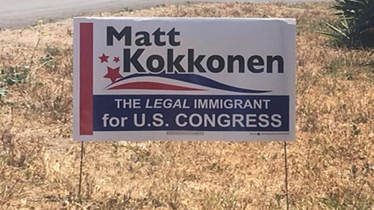 A sign for Matt Kokkonen features the slogan “The legal immigrant for U.S. Congress.”