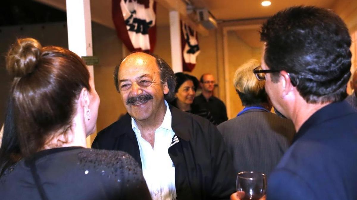 Katcho Achadjian talks to supporters while watching election returns at a party in Arroyo Grande. He was battling with Justin Fareed for second place in the race to succeed Lois Capps.