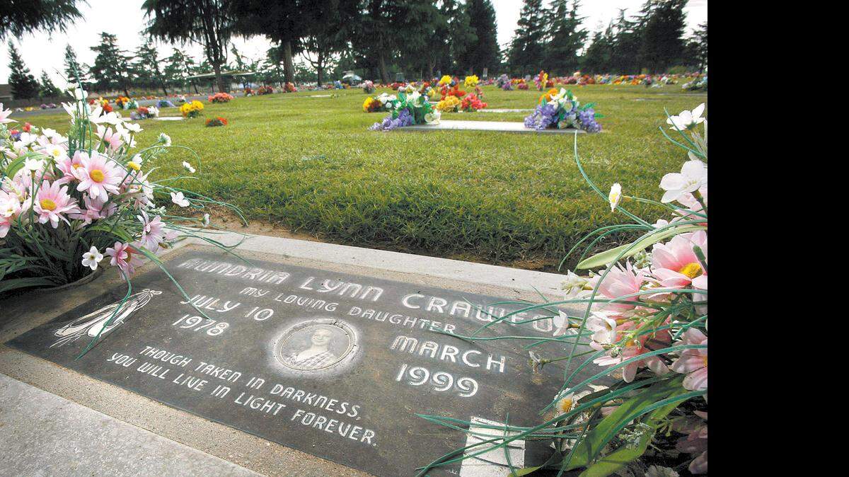 At the Clovis Cemetery, Aundria Crawford's gravestone includes the inscription: 'Though taken in darkness, you will live in light forever.'