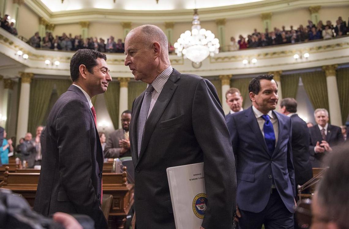 Gov. Jerry Brown arrives to deliver the State of the State in the Assembly Chamber at the Capitol followed by Assembly Speaker elect Anthony Rendon, right, in January.