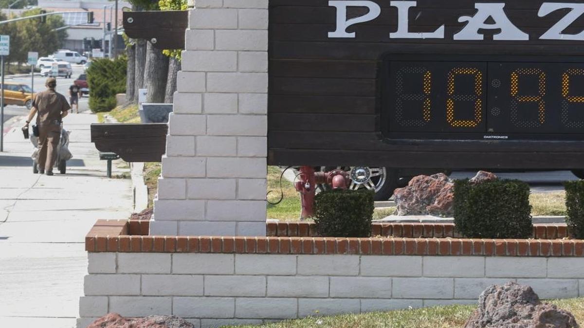 A UPS driver works in 109-degree heat in Atascadero.