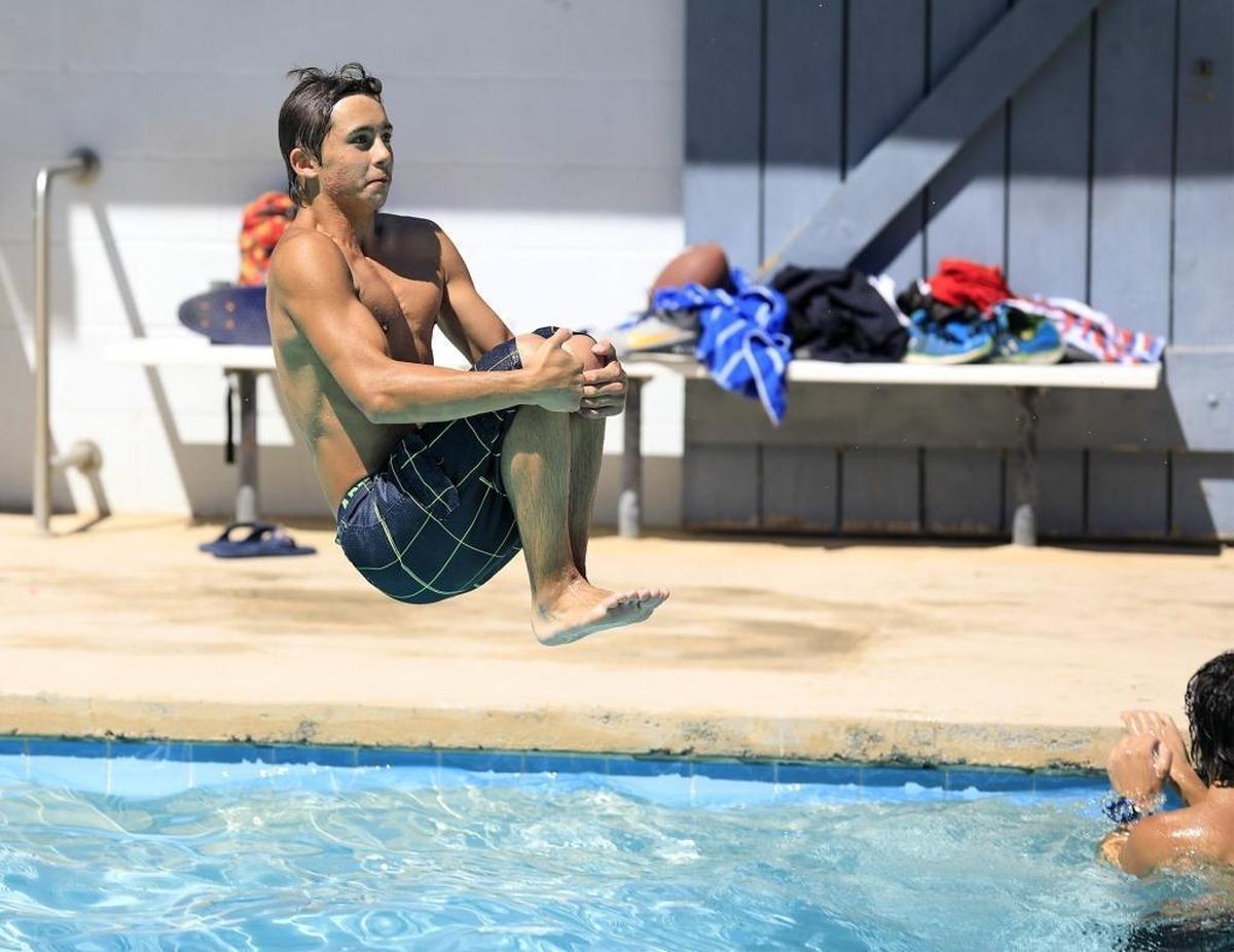 Cameron Montgomery of San Miguel does a cannonball into the San Miguel Pool in 2017. The swimming pool will reopen in July 2021 along with two other North County pools run by the San Luis Obipso County Parks and Recreation Department.