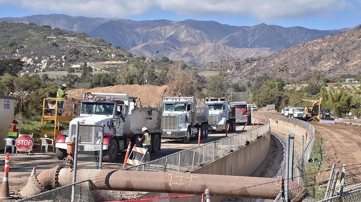 Trucks work to clear rocks and mud from the Santa Monica debris basin near Carpinteria on Wednesday, February 28, 2018. It is the largest debris basin on the South Coast and all the rest have been emptied following the Jan. 9 debris flow, according to Rob Lewin, director of the Office of Emergency Management.