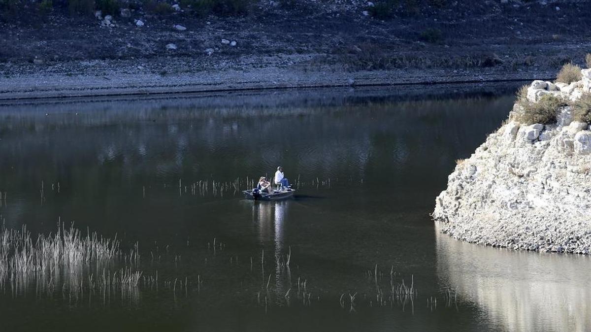 A couple fish from their boat on a recent warm, sunny Sunday at Lopez Lake, where a lack of rainfall once again threatens water levels.