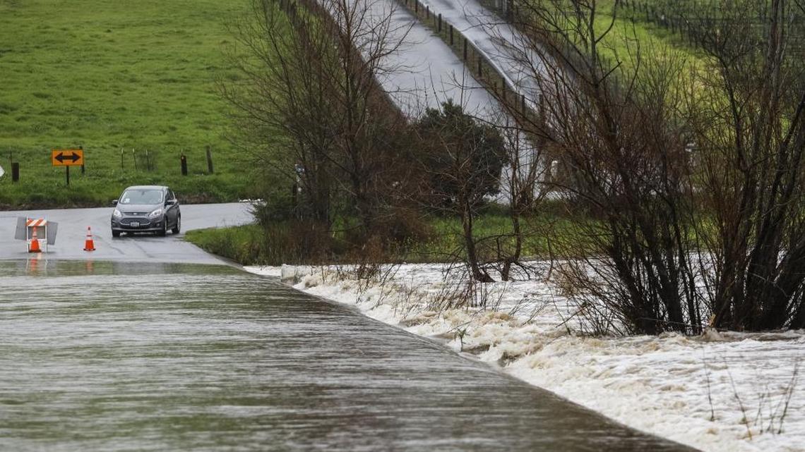 San Luis Creek flows over San Luis Bay Drive on Feb. 6.