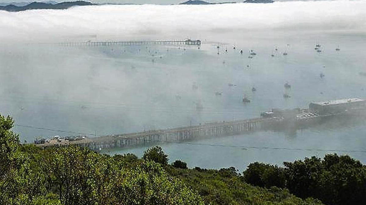 A temperature inversion layer creates fog along Avila Beach.