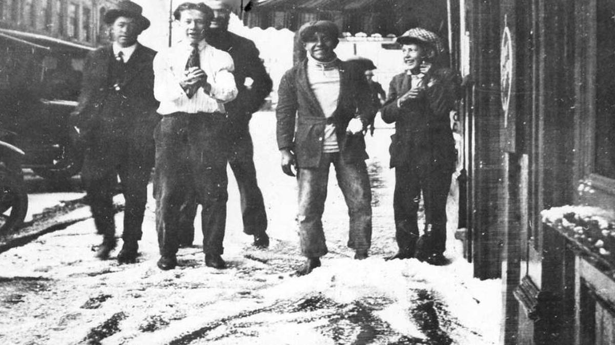 Unidentified men enjoying snow on the streets of San Luis Obispo in 1922.
