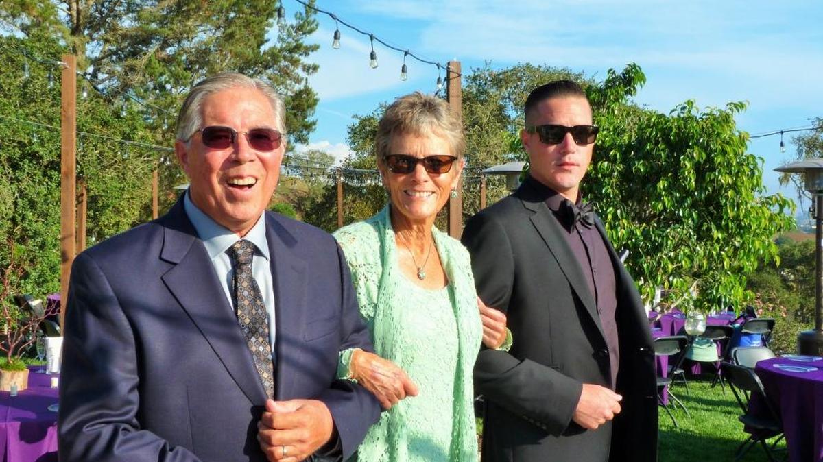 Sue Davis poses with her husband, Ben, and son Rob at the wedding.