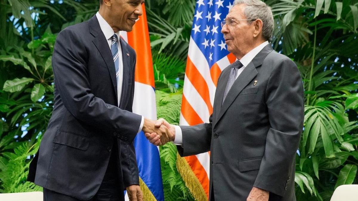 In this March 21, 2016 file photo, President Barack Obama shakes hands with Cuban President Raul Castro during their meeting at the Palace of the Revolution in Havana, Cuba.