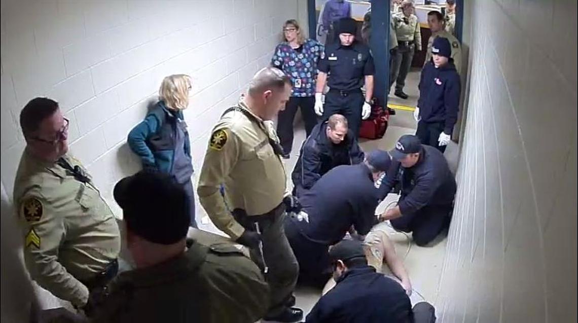 Sheriff's Office deputies, county medical physicians and a Cal Fire medic team perform CPR on inmate Andrew Holland on Jan. 22, 2017, after Holland collapsed after being held in a restraint chair for nearly two days.