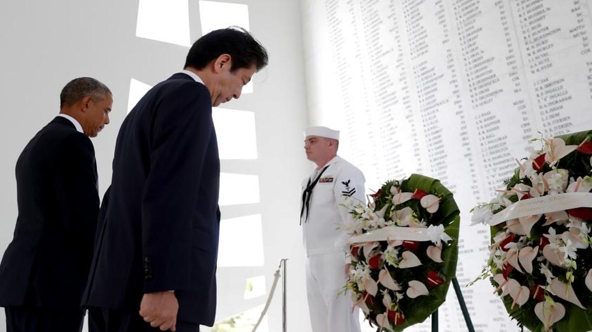 President Barack Obama and Japanese Prime Minister Shinzo Abe visit the USS Arizona Memorial on Tuesday.