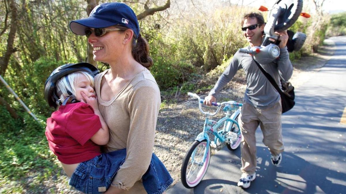 Ethan Scrudato, 3, gets a lift from his mother, Tina, after an adventure on the Bob Jones Bike Trail in Avila Beach in 2011.