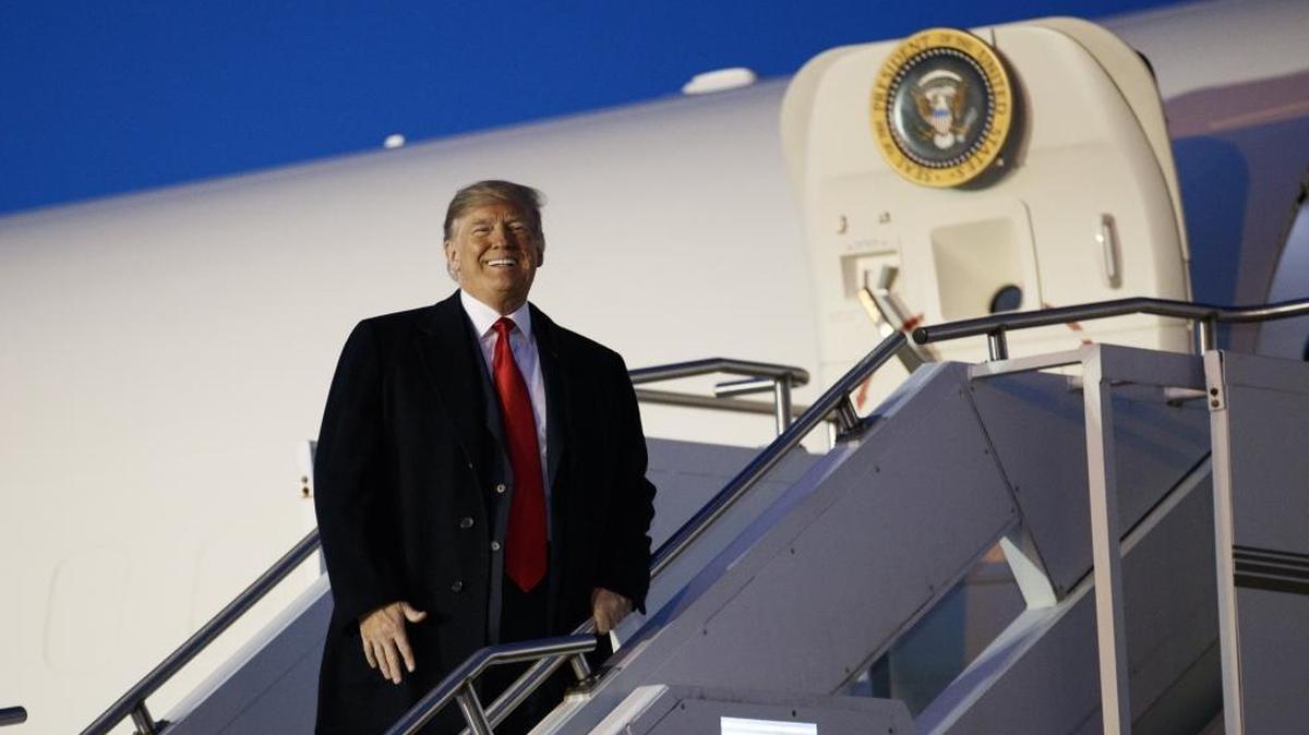 President Donald Trump on Air Force One at Pittsburgh International Airport on Saturday. Trump is due to visit California on Tuesday.