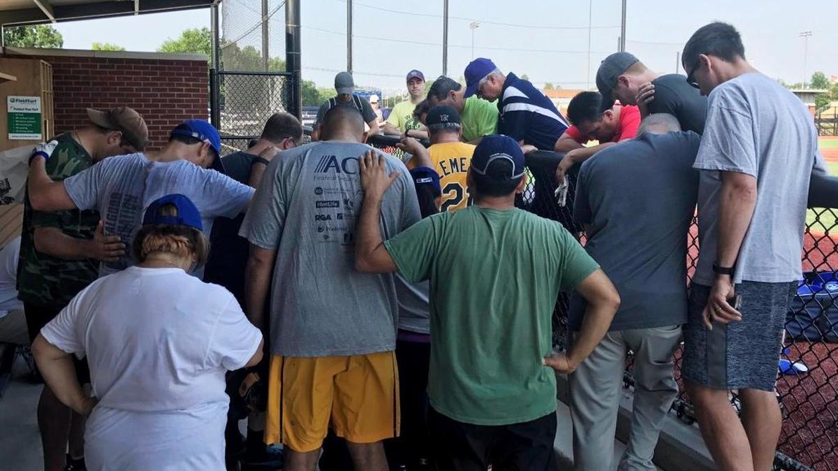 House Democrats pray for their Republican colleagues after hearing that a gunman fired on them at a baseball practice in Alexandria, Va., on Wednesday.