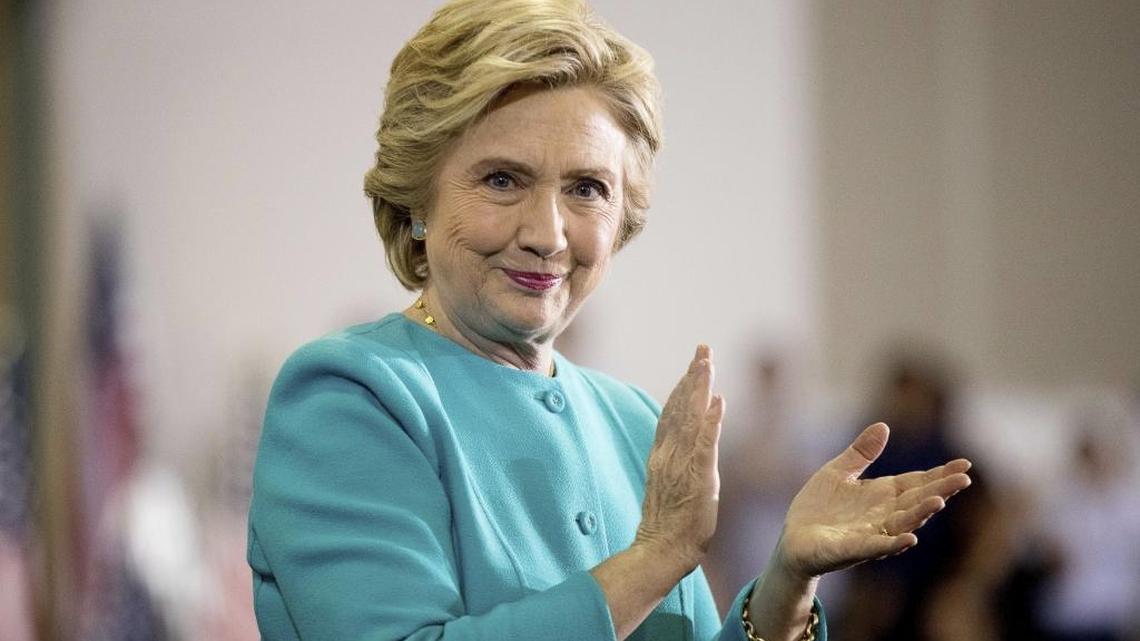 Democratic presidential candidate Hillary Clinton claps as she finishes speaking at a rally at Palm Beach State College in Lake Worth, Fla., Wednesday.