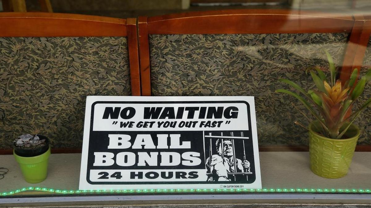 A sign in a bail bonds office across from the Hall of Justice in San Francisco. The cash bail bond system discriminates against poor people who lack homes to put up as security for getting out of jail.