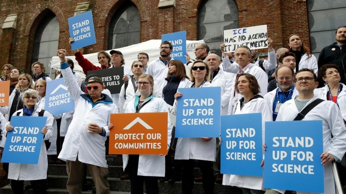 Scientists hold signs during a rally in conjunction with the American Geophysical Union’s fall meeting Dec. 13, 2016, in San Francisco. The rally was to call attention to what scientists believe are unwarranted attacks by the incoming Trump administration against scientists advocating for the issue of climate change and its impact.