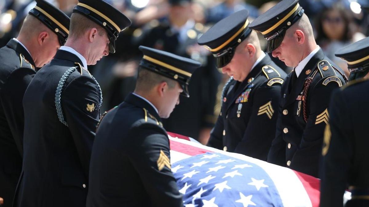 Soldiers tend to the casket of Ricky Best at his burial service with military honors at Willamette National Cemetery in Portland, Ore., Monday, June 5, 2017. Best was one of two men killed May 26 during an attack on a Portland light-rail train.