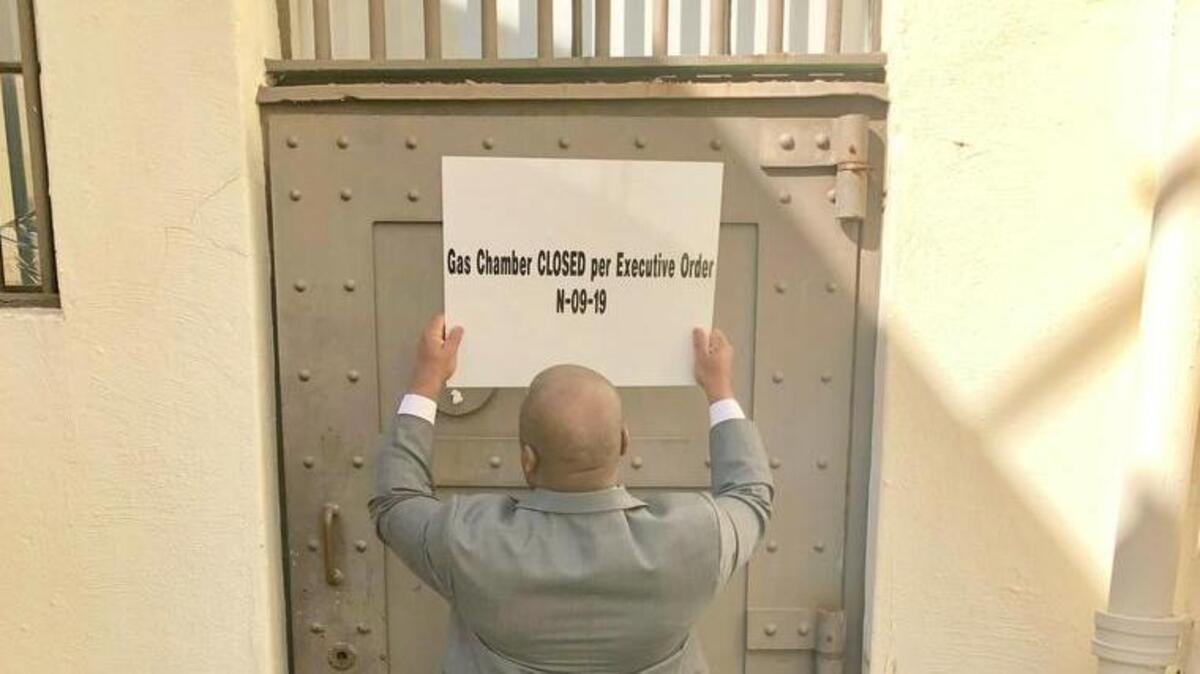 In this March 13, 2019, handout provided by the California Department of Corrections and Rehabilitation a closed sign is placed on the door leading to the gas chamber at San Quentin State Prison, in San Quentin, Calif. Gov. Gavin Newsom signed an executive order, Wednesday, placing a moratorium on the death penalty. (California Department of Corrections and Rehabilitation via AP)