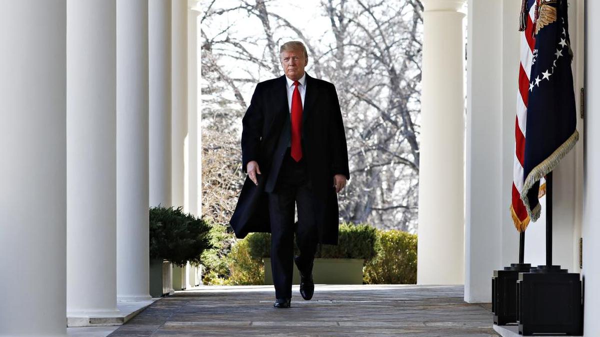 President Donald Trump walks through the Colonnade from the Oval Office of the White House as he arrives to announce a deal to temporarily reopen the government, Friday, Jan. 25, 2019, from the Rose Garden of the White House in Washington. Honey French of Nipomo argues that Trump donates his salary to national causes, so there is no need to suspend his pay.