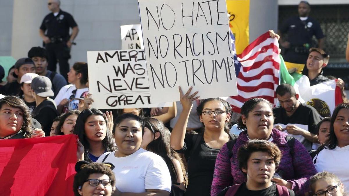 In this Nov. 14, 2016 file photo, students from several high schools rally on the steps of City Hall after walking out of classes to protest the election of Donald Trump as president in downtown Los Angeles.