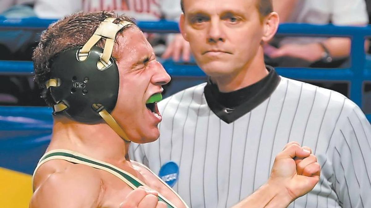 Cal Poly's Chad Mendes celebrates after defeating Oklahoma State's Nathan Morgan 1-0 in a 141 lb. semifinal match to advance to the finals at the NCAA wrestling national championships Friday, March 21, 2008, in St. Louis.