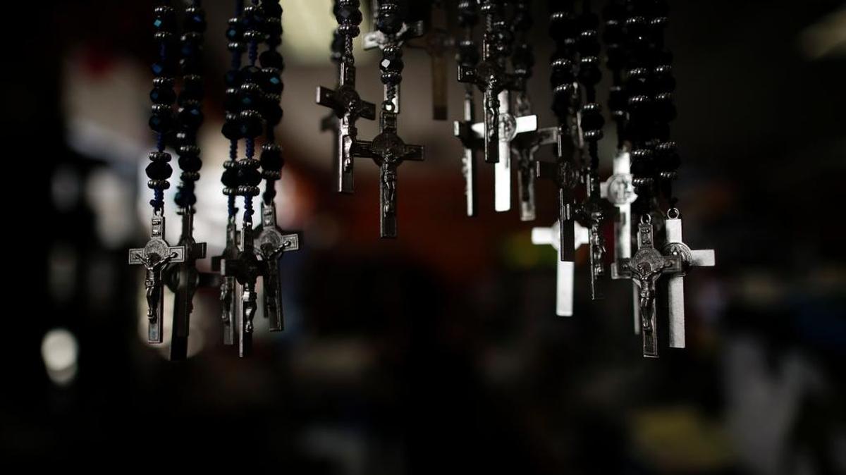 A set of crosses are displayed for sale at La Guadalupana in Florence, Ky., on April 27, 2018. Many people who had a relative arrested in the raid or left in fear that might be next have turned to their faith.