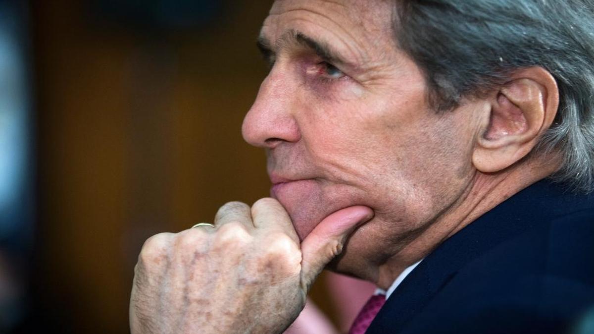 Secretary of State John Kerry listens as President Barack Obama speaks March 14 at the Chief of Missions Conference at the State Department in Washington.