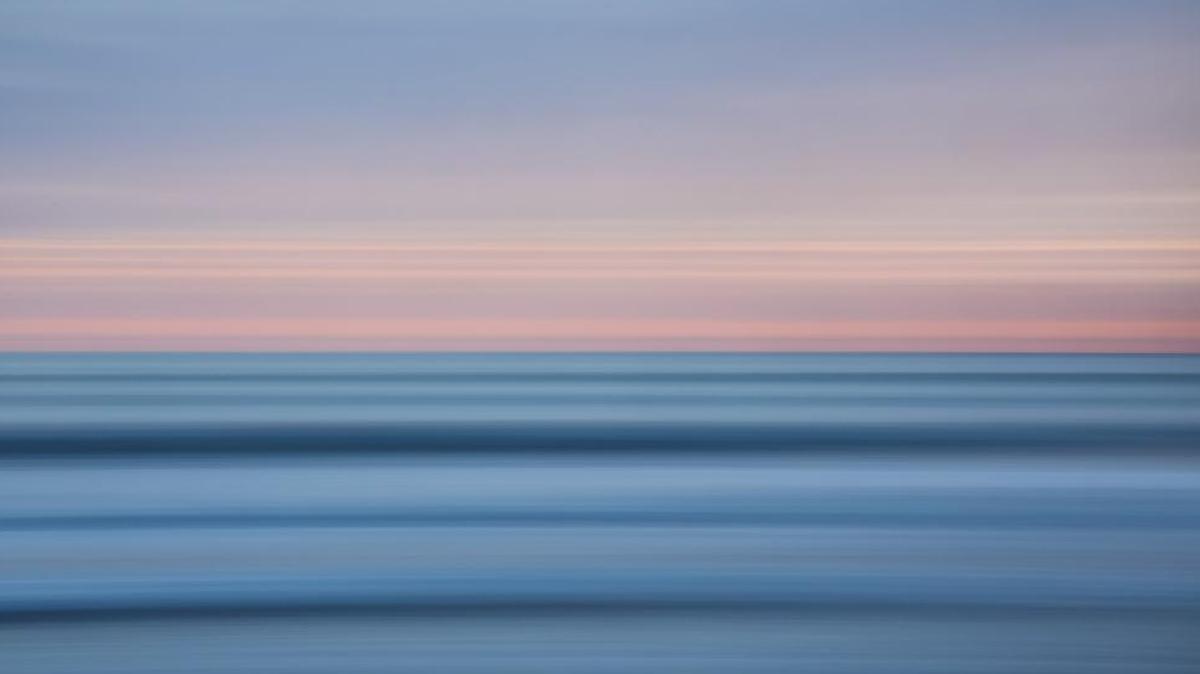 A long exposure captures the pastel tones of sunset in Shell Beach.