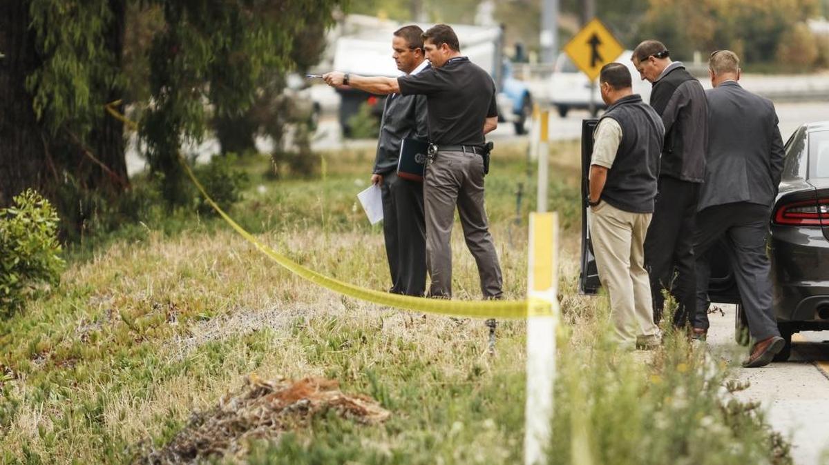 Authorities investigate the area where an Arroyo Grande officer shot a man, who police say, was attempting to carjack vehicles in August.