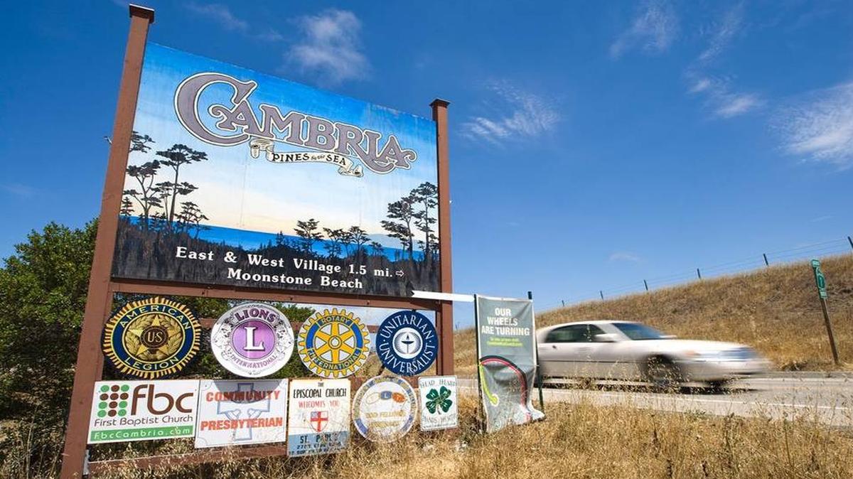 A car whizzes past the Cambria sign on Highway 1 at the south end of town.