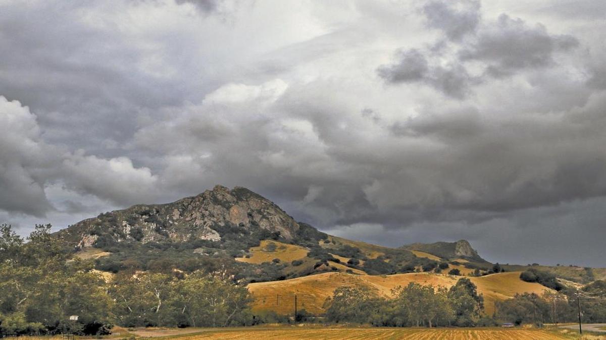 Stormy clouds hover around Bishop Peak.