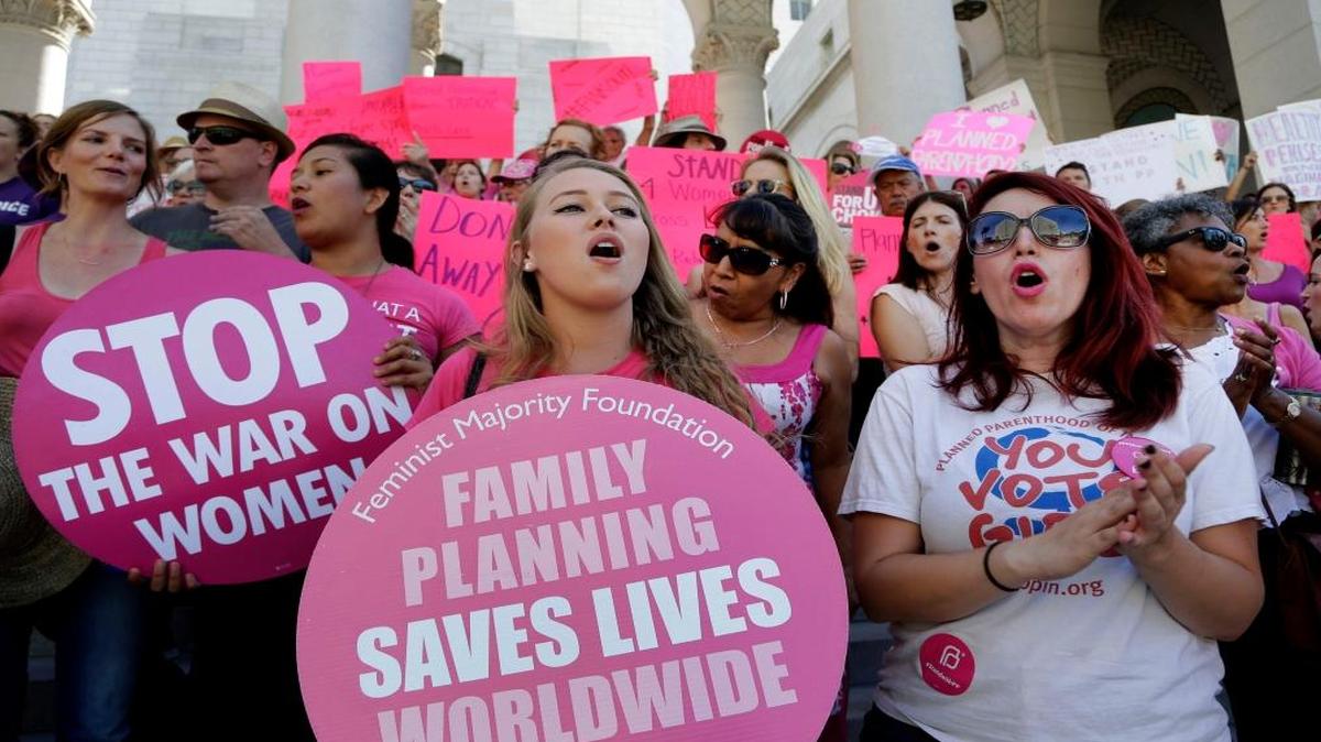 Planned Parenthood supporters rally for women’s access to reproductive health care on “National Pink Out Day” at Los Angeles City Hall in September 2015.