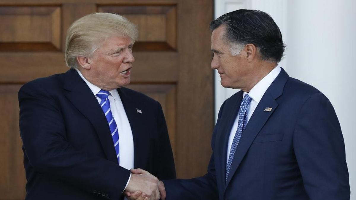President-elect Donald Trump and Mitt Romney shake hands at the entrance of Trump National Golf Club Bedminster clubhouse in Bedminster, N.J., Saturday, Nov. 19, 2016, after meeting.