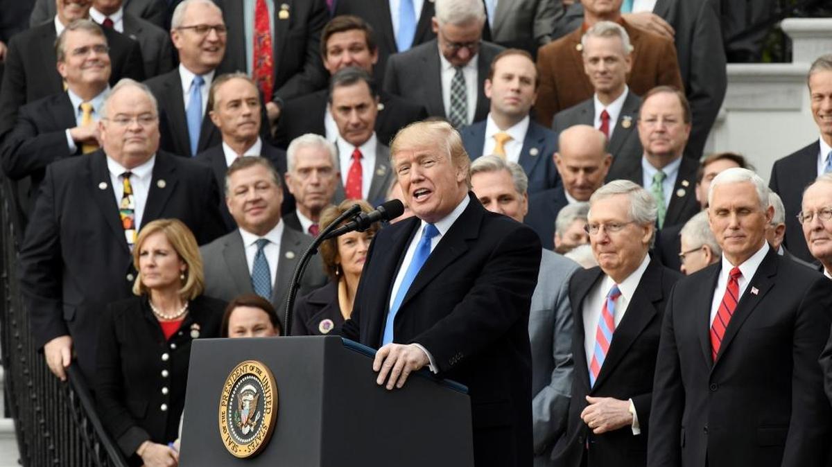 President Donald Trump celebrates the tax bill's passage with members of the House and Senate on Wednesday, Dec. 20, 2017 during an event on the South Portico of the White House in Washington, D.C.