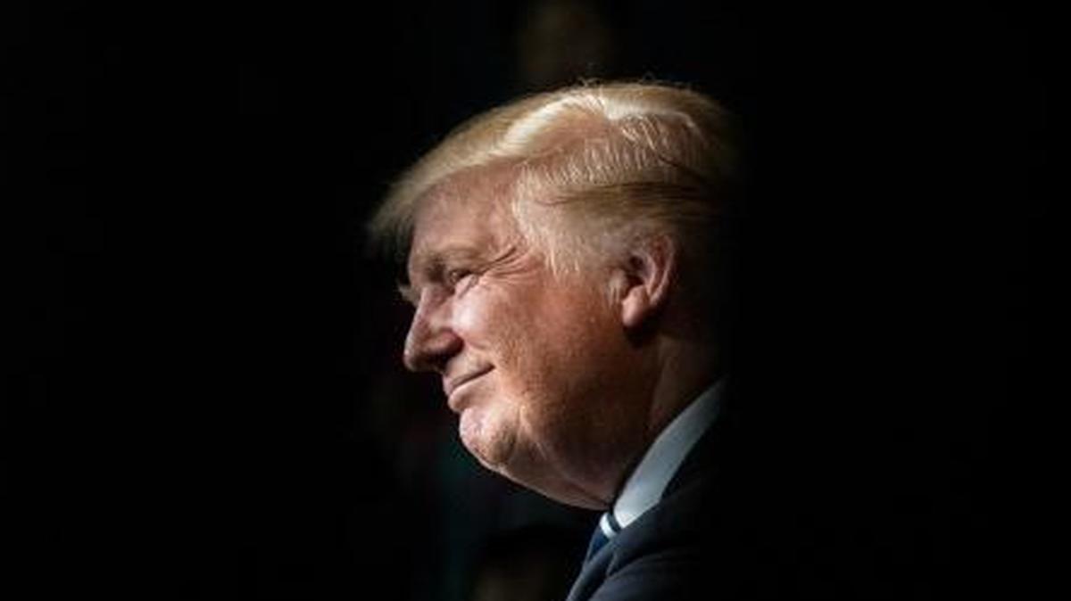 Donald Trump smiles as the crowd chants “President Trump” on Nov. 1 during a campaign rally at the W.L. Zorn Arena in Eau Claire, Wis.