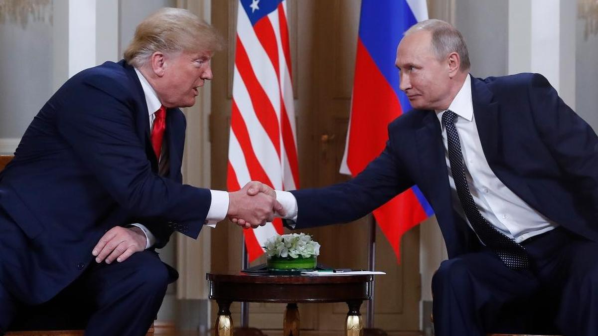 U.S. President Donald Trump, left, and Russian President Vladimir Putin, right, shake hand at the beginning of a meeting at the Presidential Palace in Helsinki, Finland, Monday, July 16, 2018. (AP Photo/Pablo Martinez Monsivais)