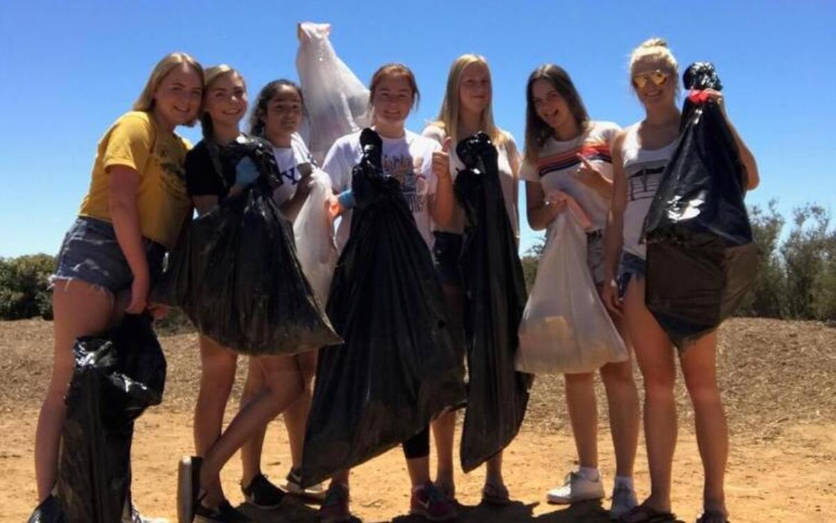 Members of the San Luis Obispo High School class of 2018 clean up trash on the Cuesta Grade.