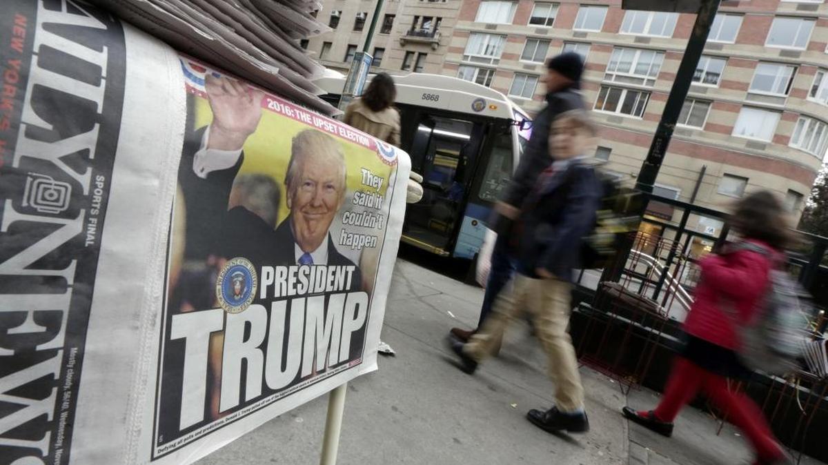 Pedestrian walk past headlines announcing the victory of President-elect Donald Trump at a news vendor’s table on New York’s Upper West Side on Wednesday.