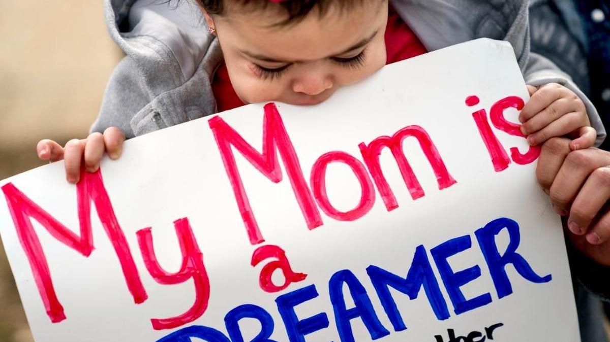 Yesenia Aguilar of Reading, Penn. holds her one year old daughter Denalli Urdaneta at an immigration rally on Capitol Hill in Washington, Tuesday, Jan. 23, 2018.