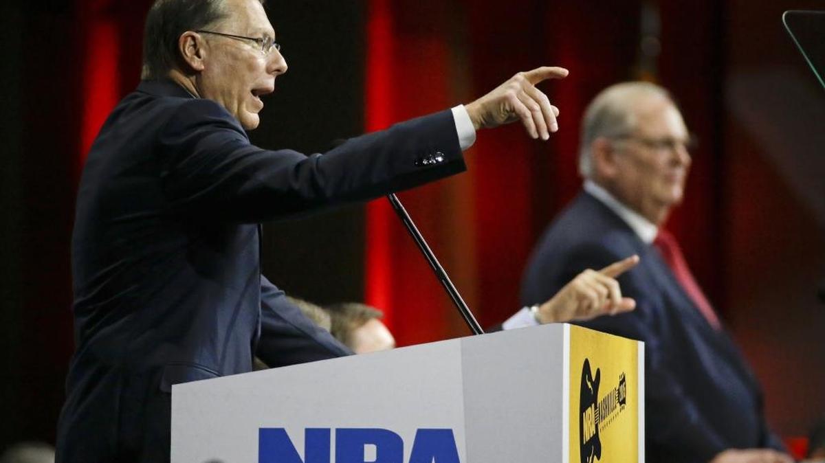 Wayne LaPierre, left, executive vice president of the National Rifle Association, speaks during the annual meeting of members at the NRA convention in 2015 in Nashville, Tenn.