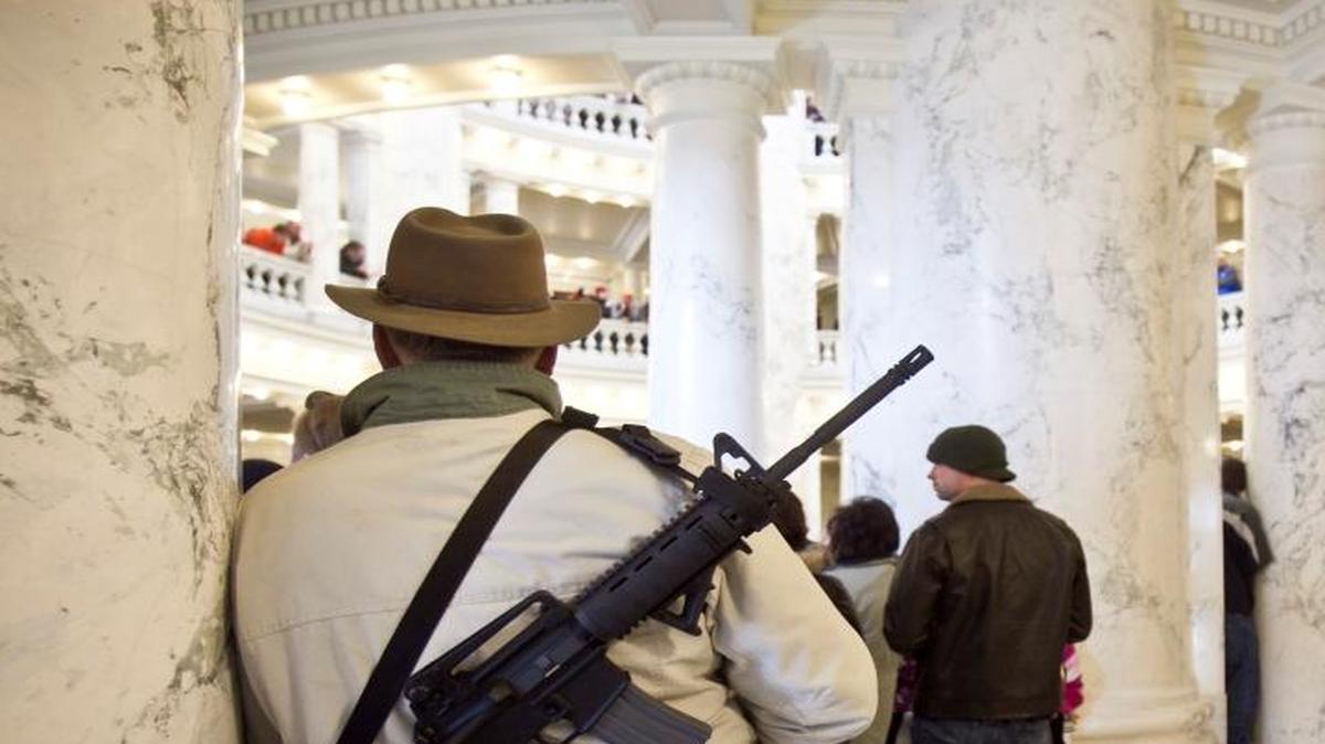 An estimated 800 pro-gun activists turned out for a rally inside the Idaho Statehouse in Boise, Idaho, on January 19, 2013. Mike Yost of Meridian, Idaho, who brought his two grandkids to the event, carried a Rock River AR 223 across his back.