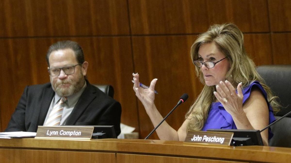 Lynn Compton, right, speaks during a San Luis Obispo County Board of Supervisors meeting in March 2017.