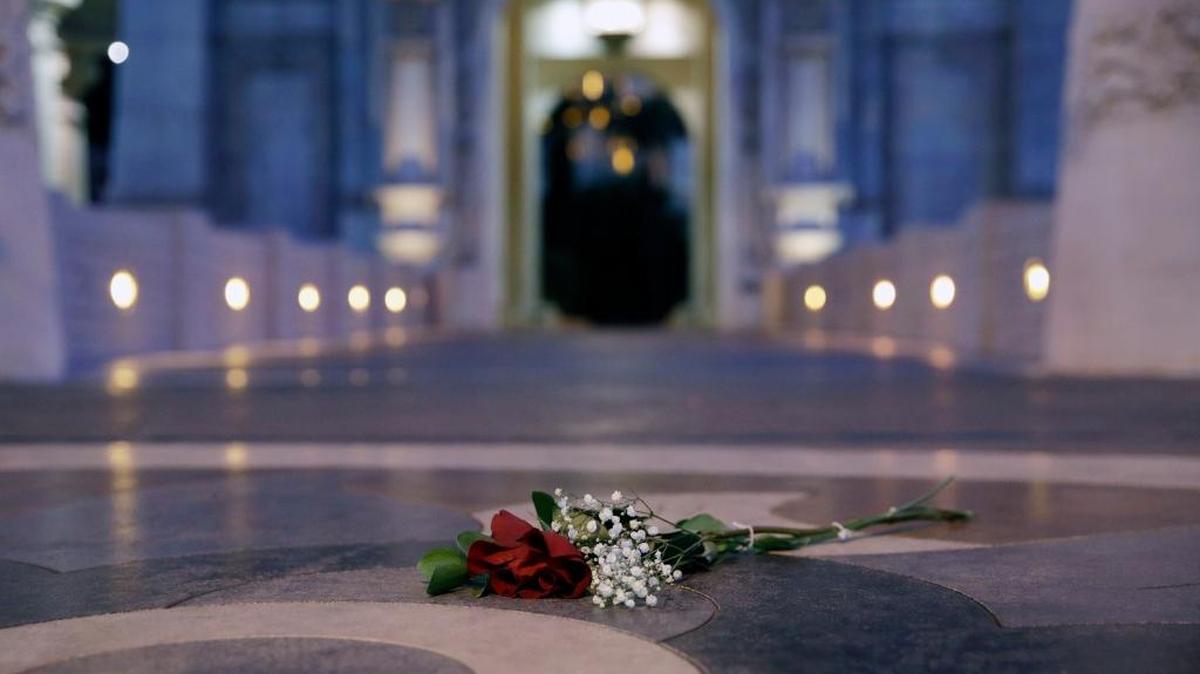 A single rose is left at the door of the Mandalay Bay hotel and casino in Las Vegas, Nev., on Tuesday, Oct. 3, 2017. A gunman opened fire on an outdoor music concert on Sunday. It was the deadliest mass shooting in modern U.S. history, with dozens of people killed and hundreds injured, some by gunfire, some during the chaotic escape.