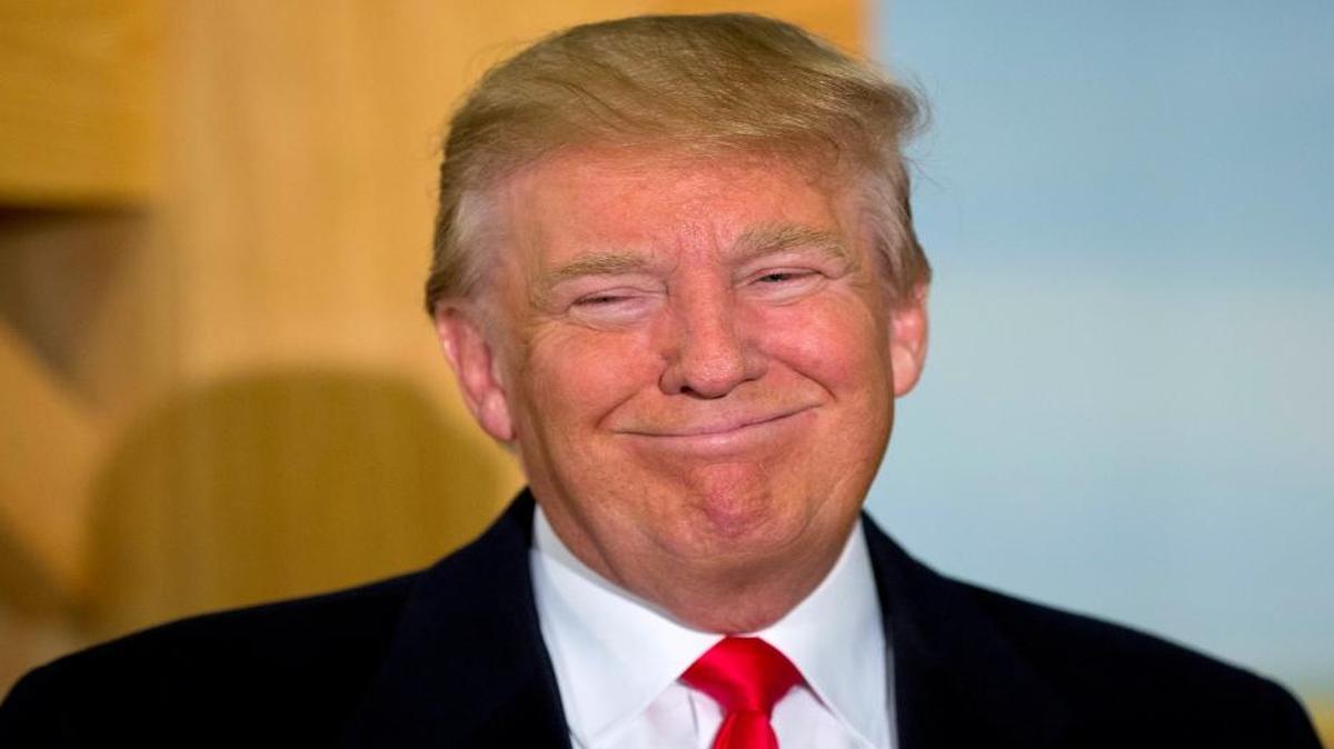 Republican presidential candidate Donald Trump smiles during a news conference at the John Wayne Museum on Jan. 19, 2016, in Winterset, Iowa.