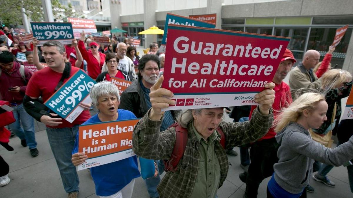 In this April 26, 2017, file photo, supporters of single-payer health care march to the Capitol in Sacramento, Calif.