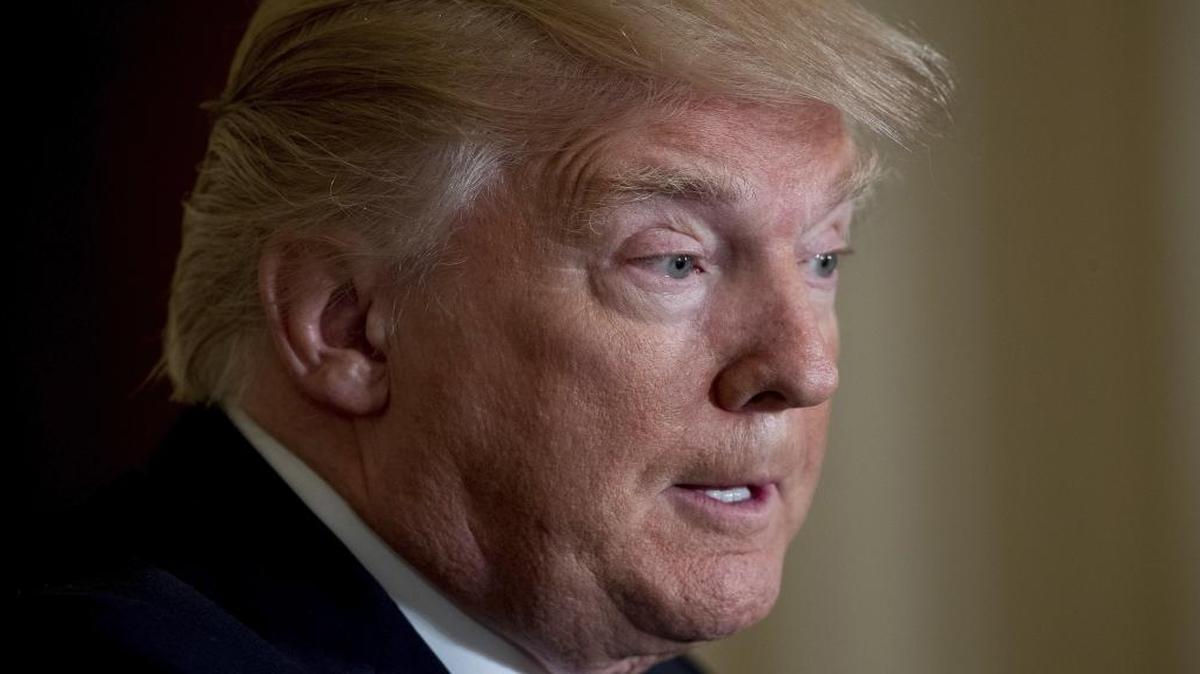 President Donald Trump pauses during a news conference in the East Room at the White House in Washington.